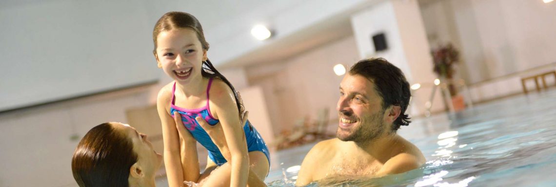 Club Med Cervinia, Italy - A family  enjoying a moment at the interior and heated pool
