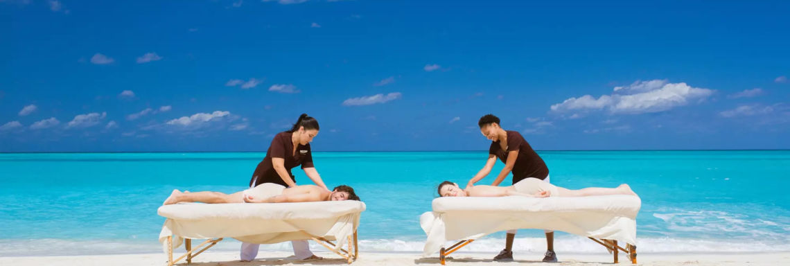 Club Med Columbus Isle, Bahamas - Couple enjoying massage by the sea