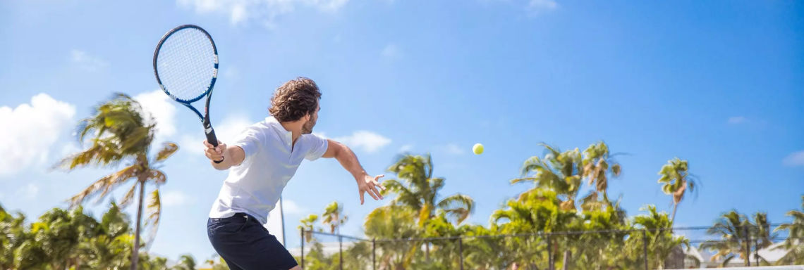 Club Med Columbus Isle, Bahamas - Man returns tennis ball thrown by G.O