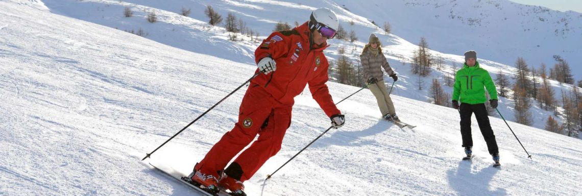 Club Med Pragelato Vialattea, Italy - Man in red coveralls skiing