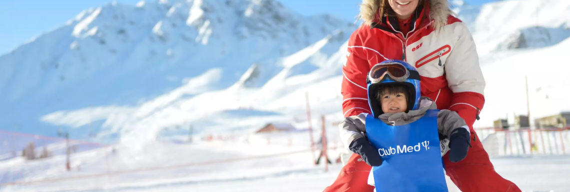 Club Med La Plagne 2100, France - A G.O helps a young child to start skiing